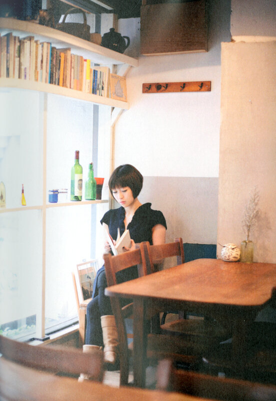 Woman reading in a cozy cafe