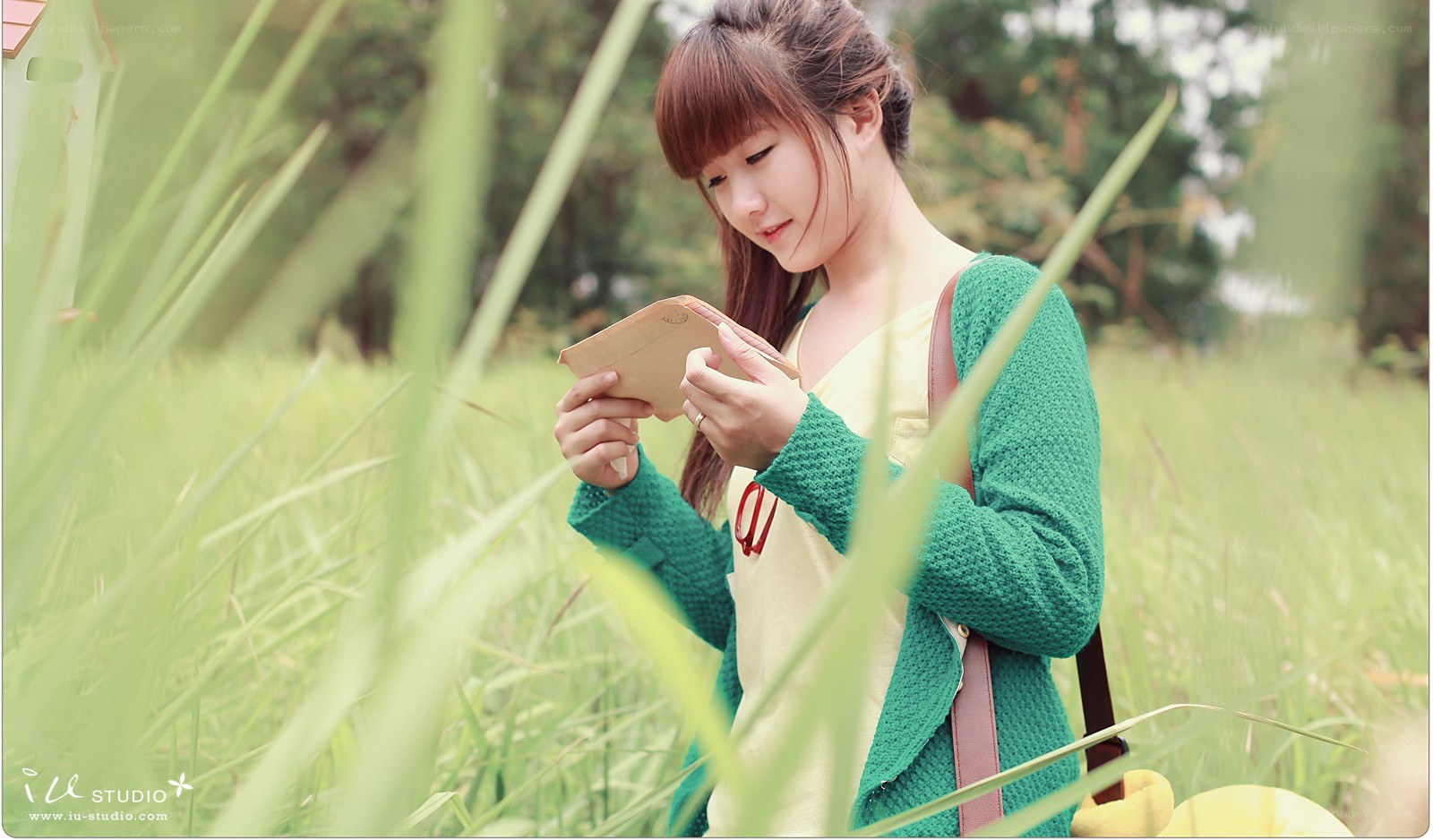 woman reading in a field
