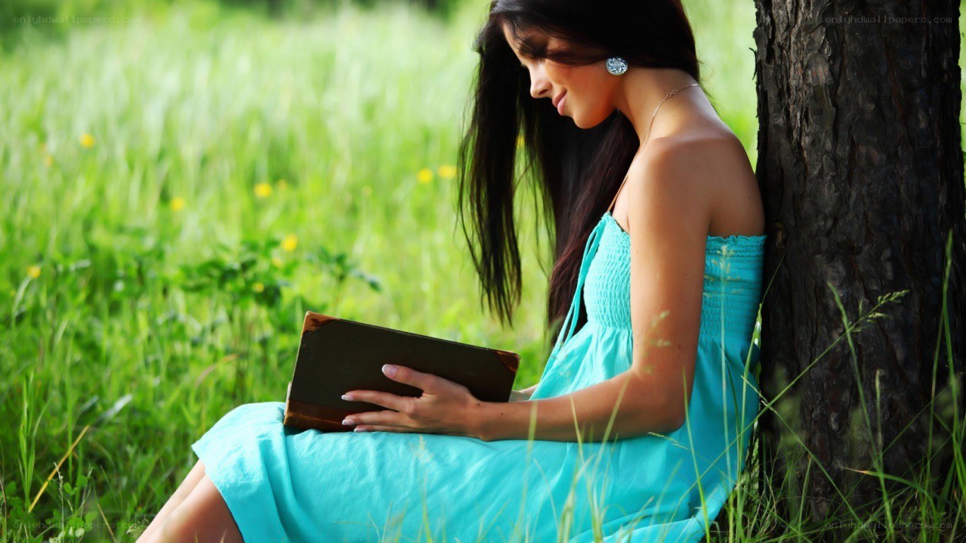 Woman reading in a field