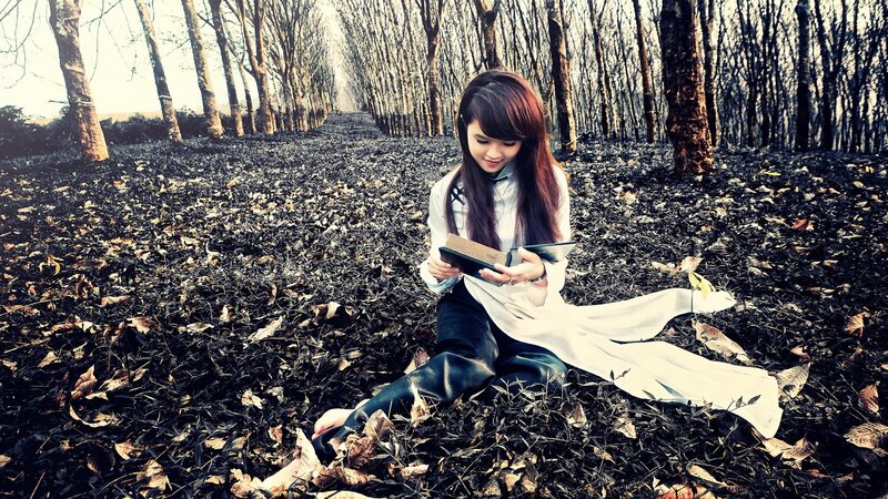 Woman reading in a forest
