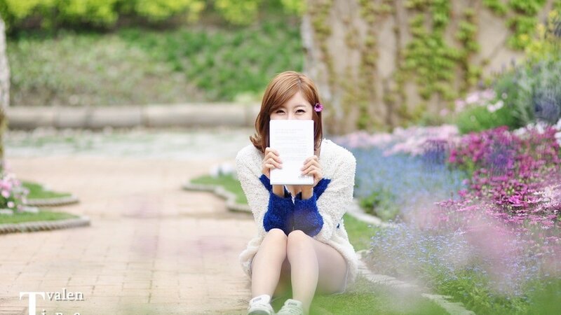 woman reading in a garden