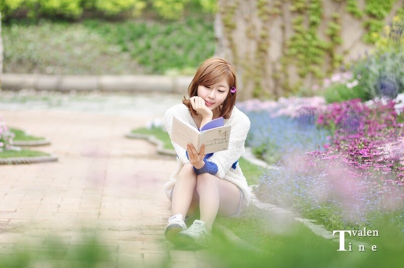 Woman reading in a garden