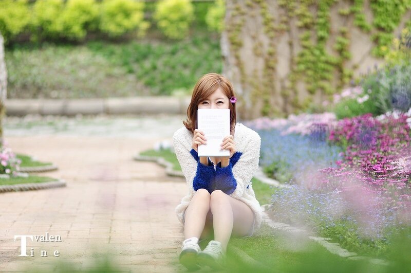 Woman reading in a garden