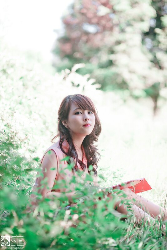 woman reading in a garden