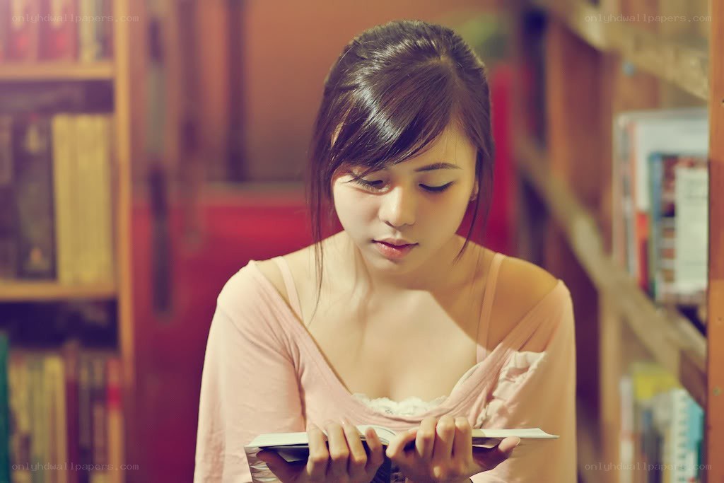 woman reading in a library