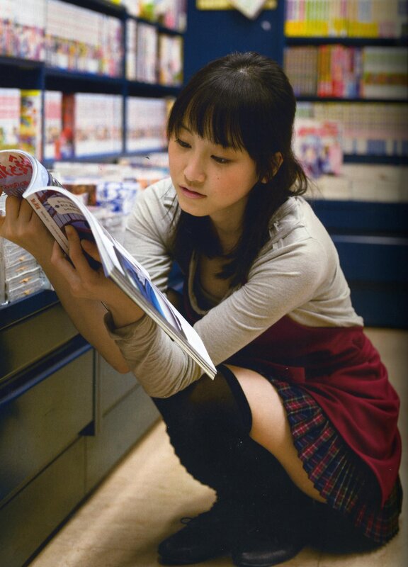 woman reading in bookstore