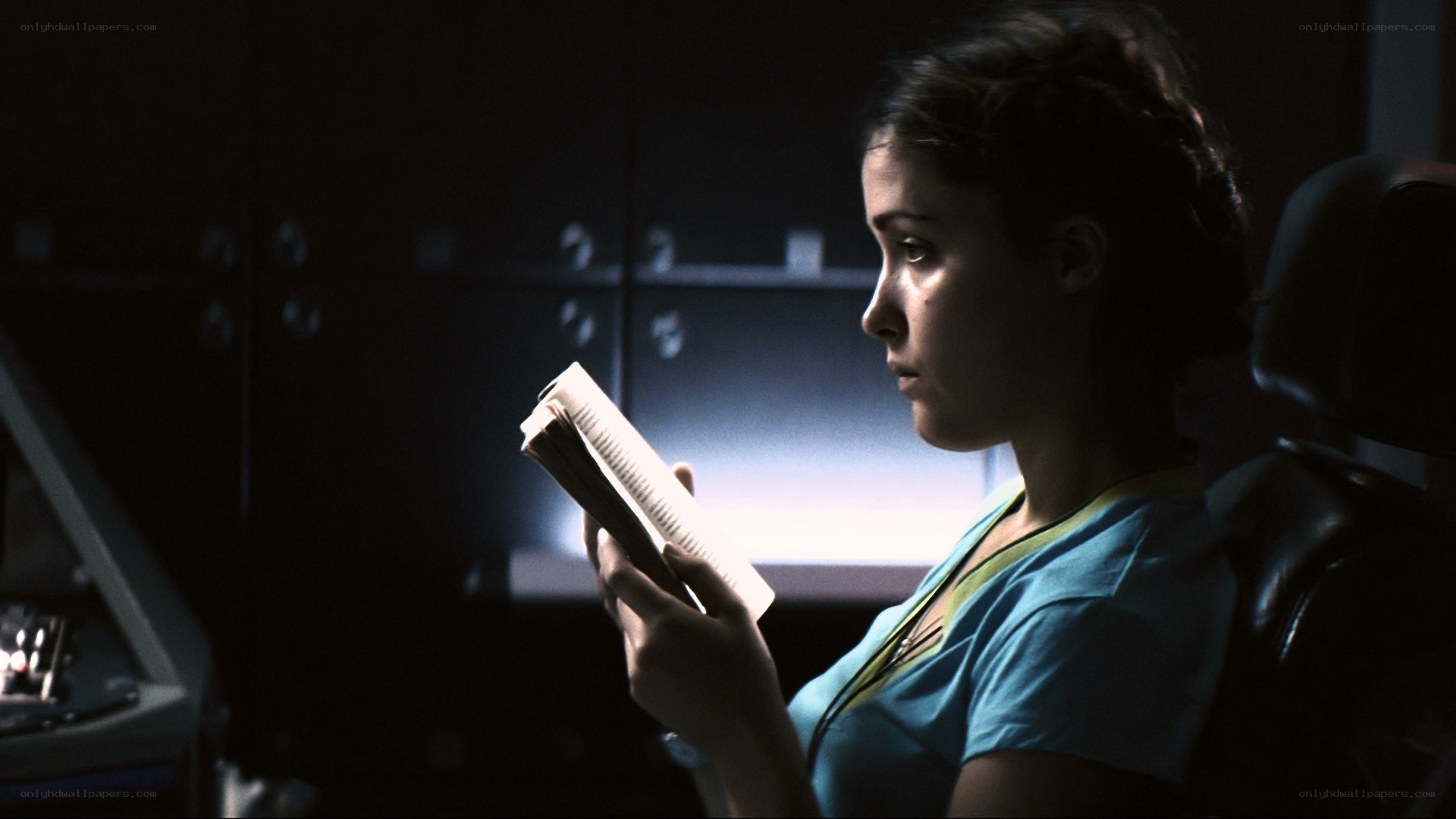 woman reading in dim light