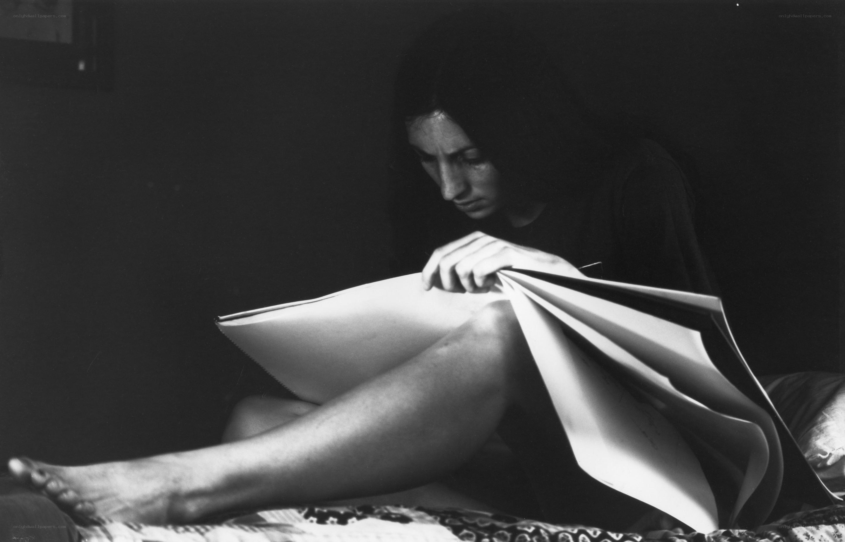 woman reading in dim light