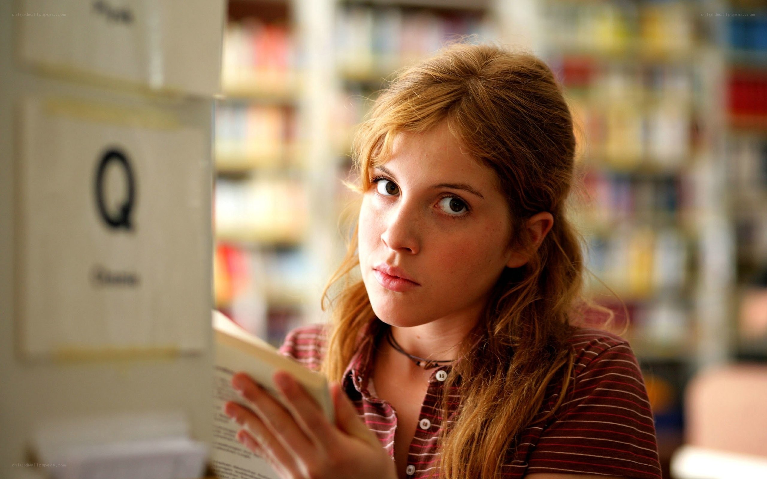 woman reading in library