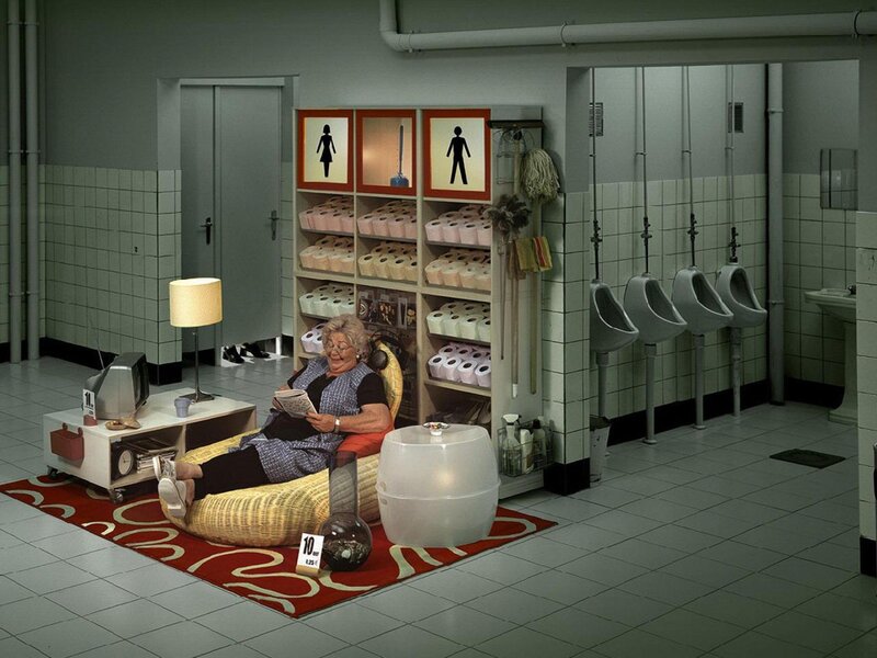 Woman Reading in Restroom — Gray