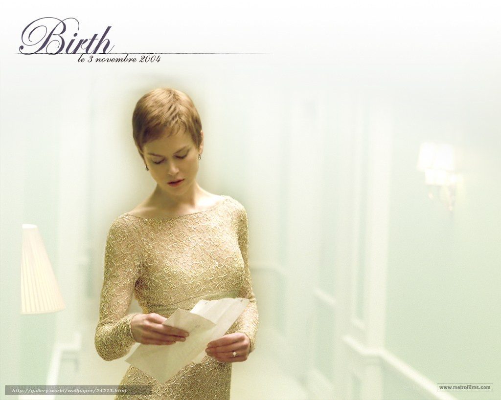 Woman reading letter in gold dress