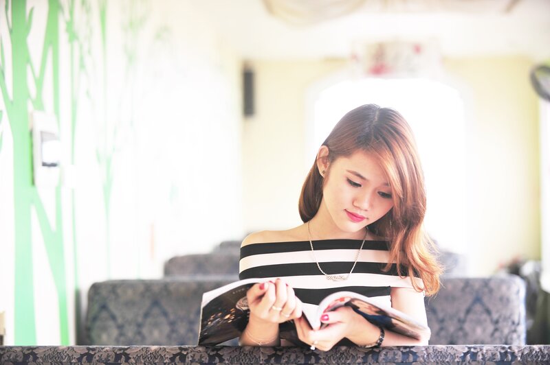 woman reading magazine
