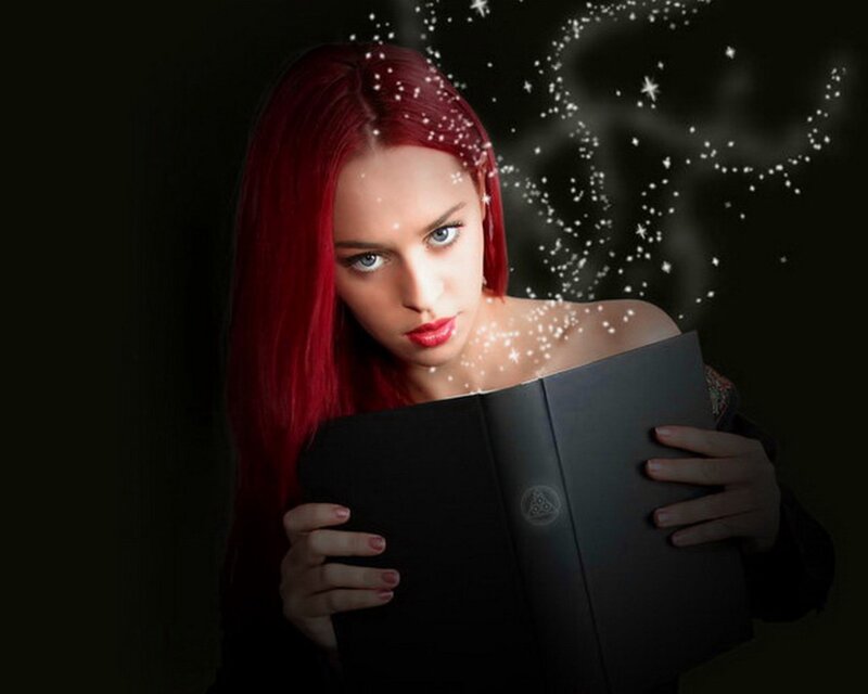 woman reading magical book