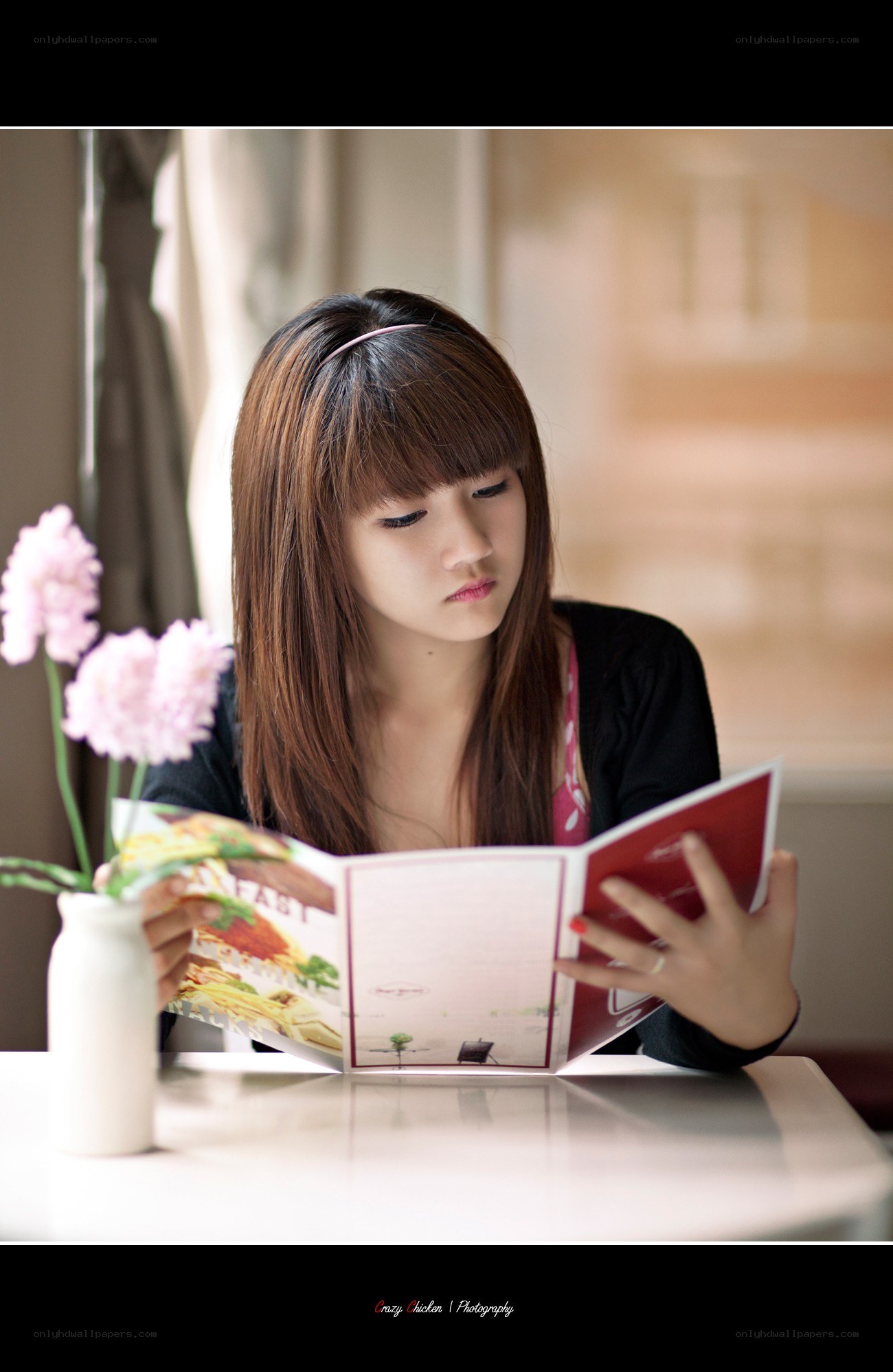 woman reading menu at cafe