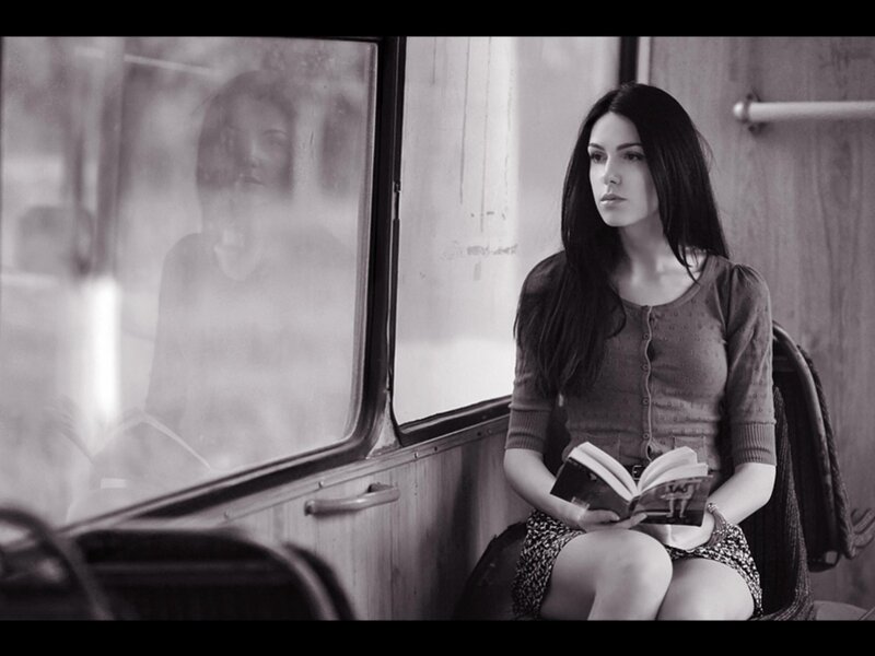woman reading on a bus