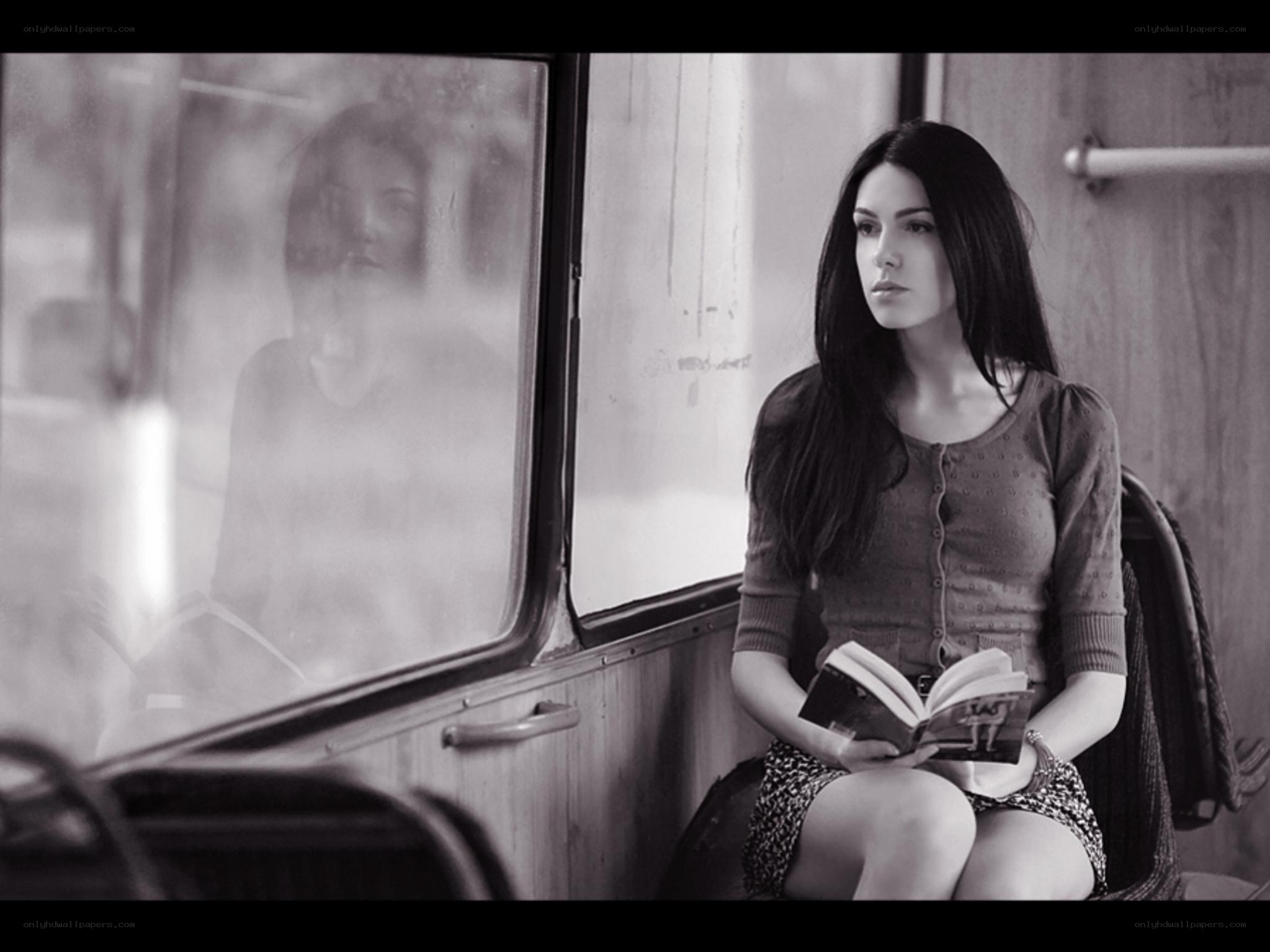 woman reading on a bus