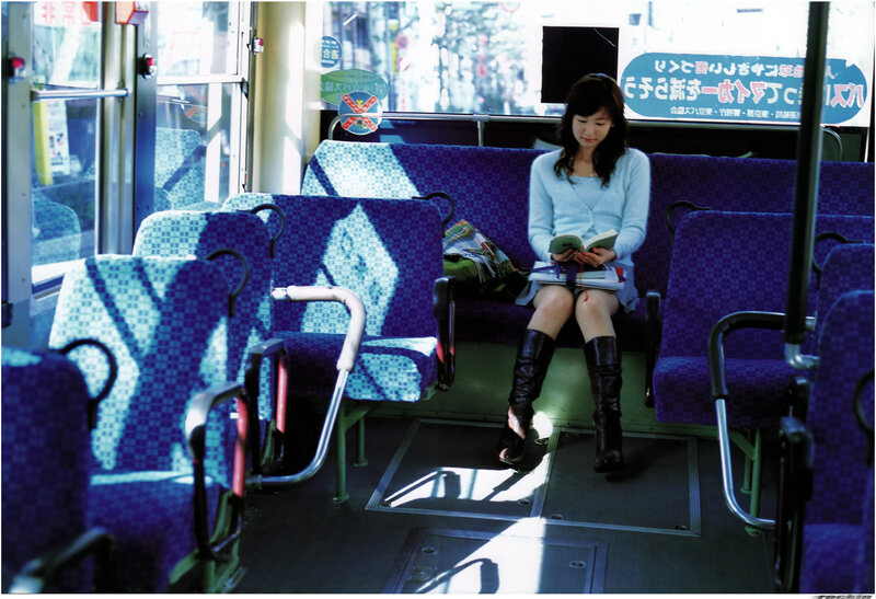 Woman reading on a bus