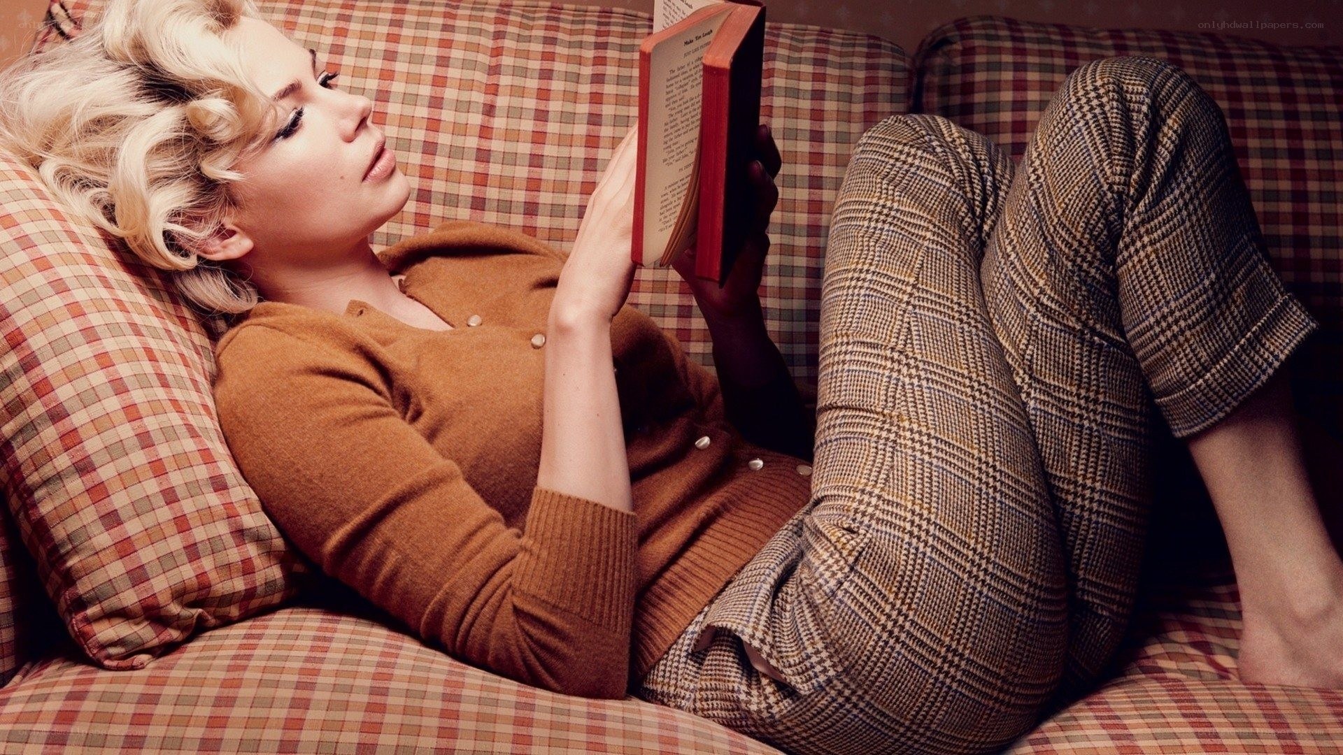 woman reading on a couch