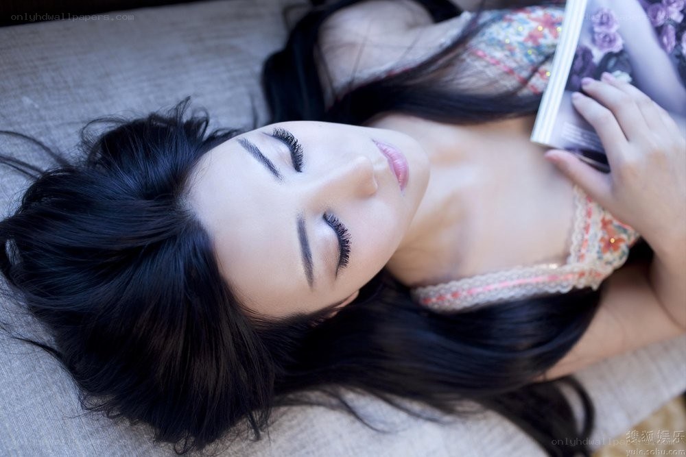 woman reading on a couch