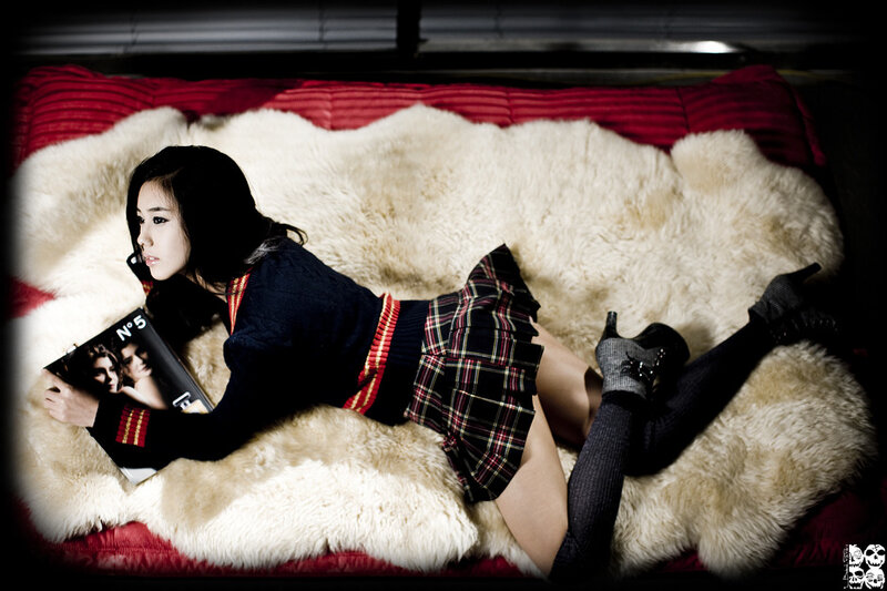 woman reading on a fur rug