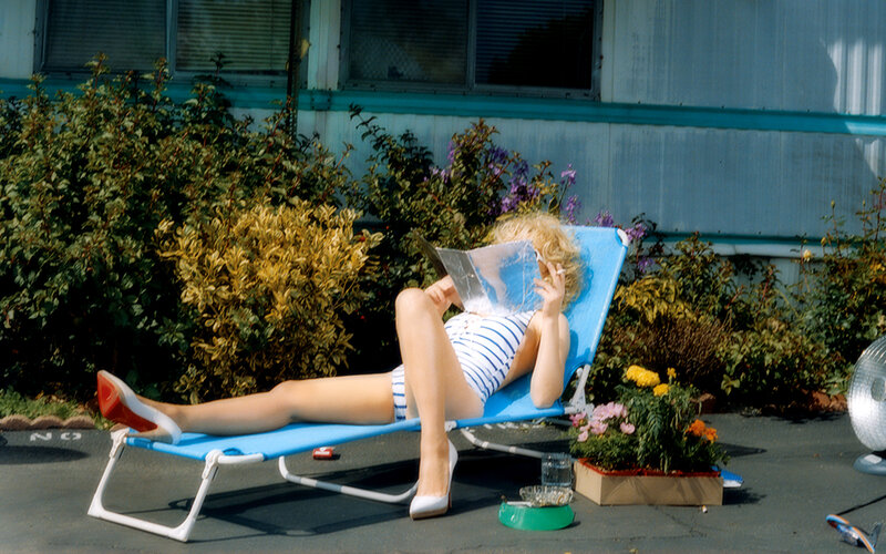 Woman reading on a lounge chair