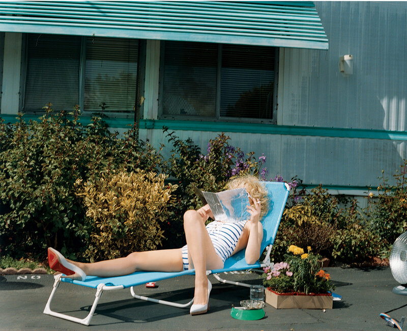Woman reading on a lounge chair