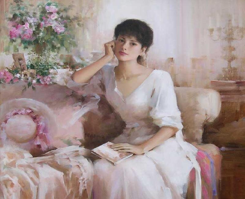 woman reading on a sofa