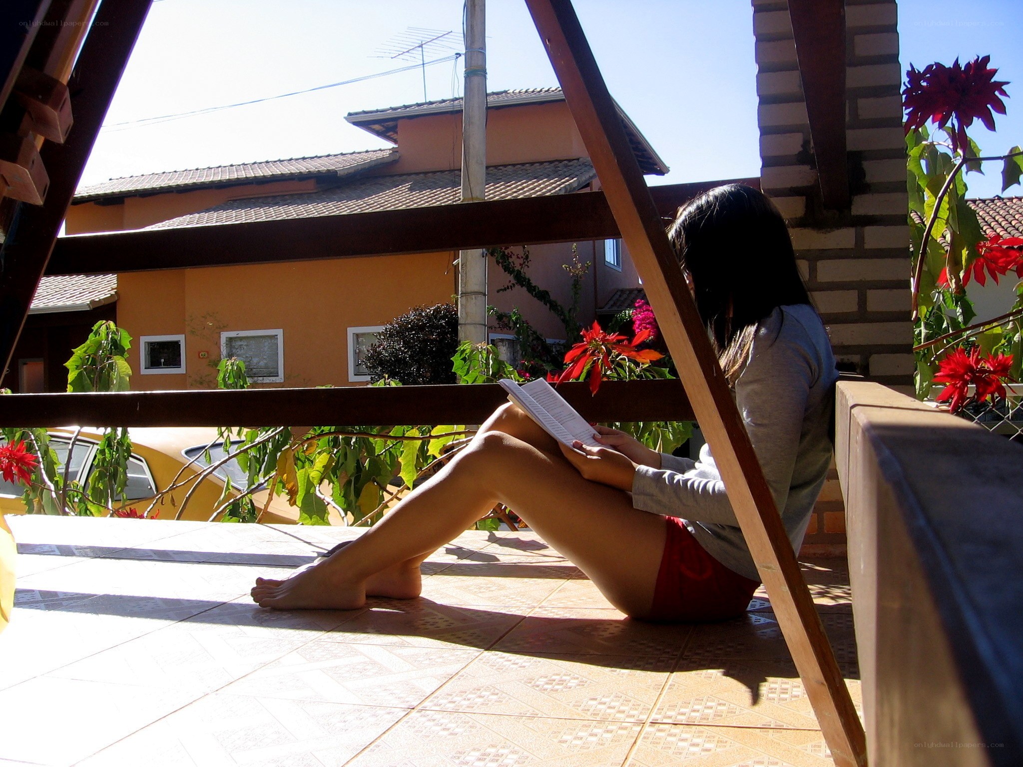 Woman reading on balcony
