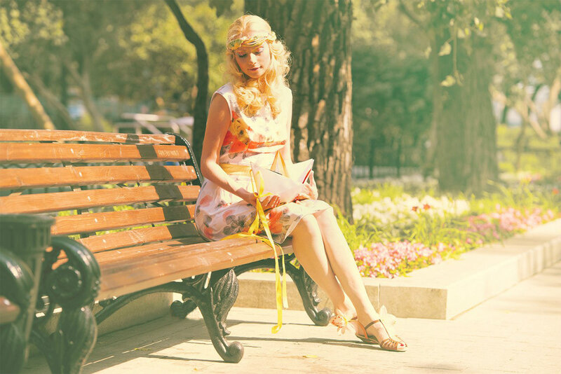 Woman Reading on Bench — Yellow