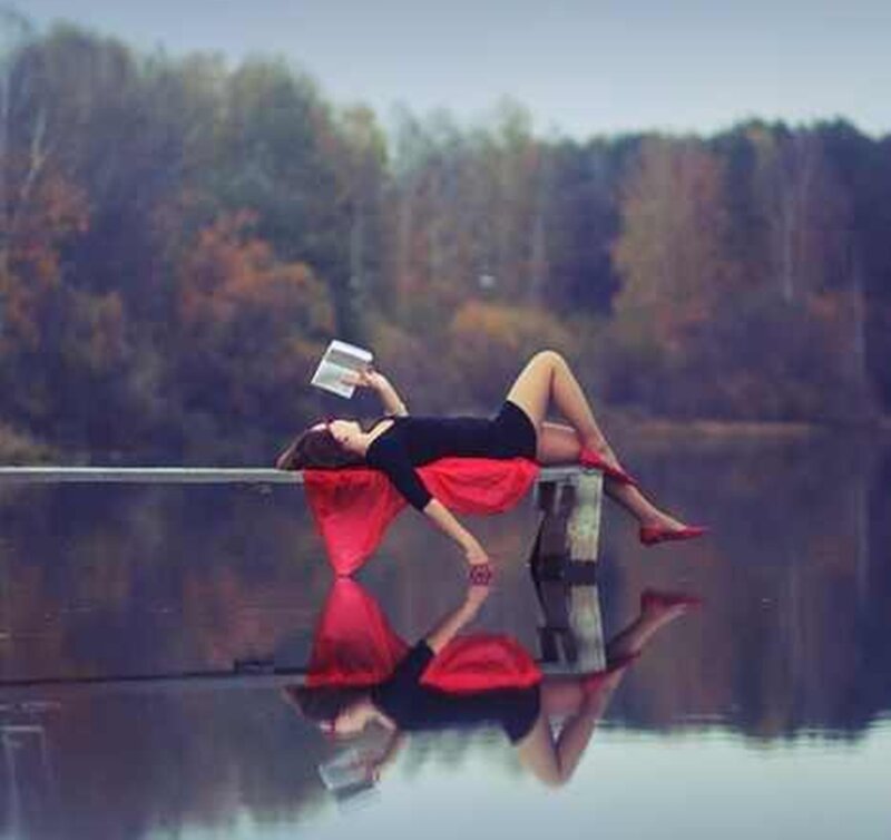 Woman Reading on Dock