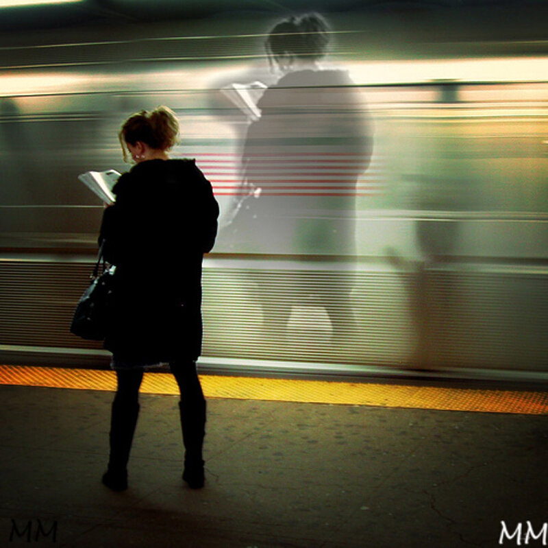 Woman Reading on Train Platform