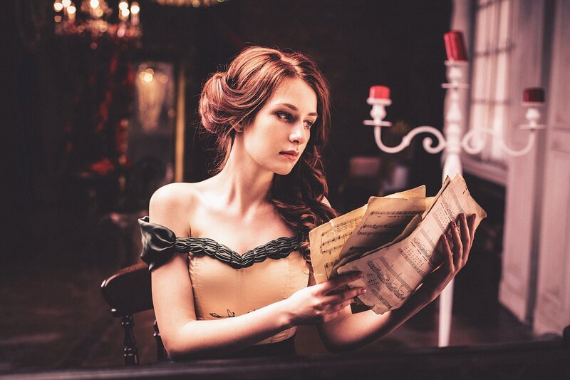 Woman Reading Sheet Music