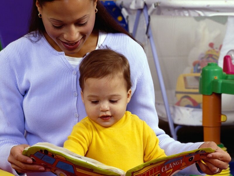 Woman Reading to Baby