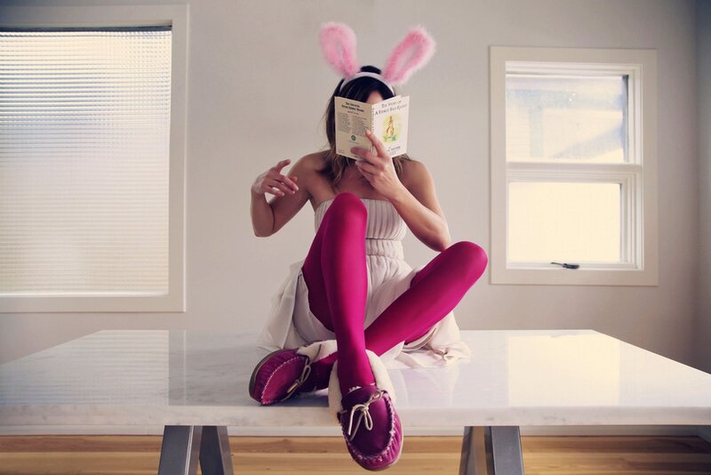 woman reading with bunny ears