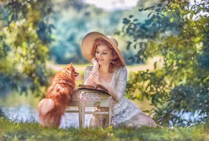 Woman Reading with Dog