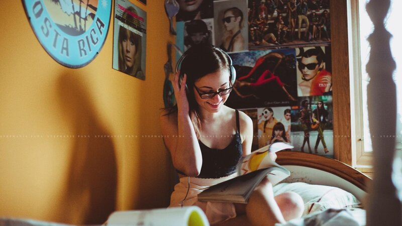 woman reading with headphones