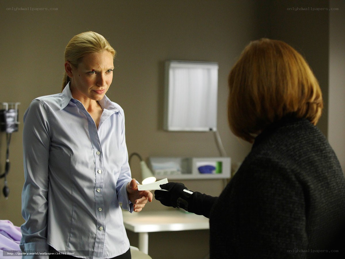 woman receiving card in clinic