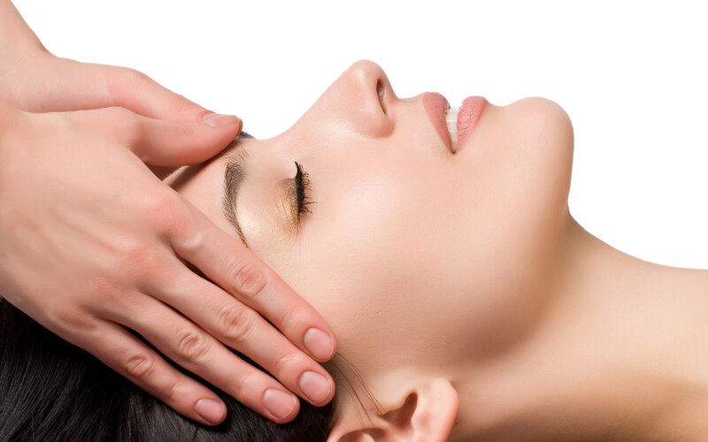 Woman Receiving Facial Massage — White