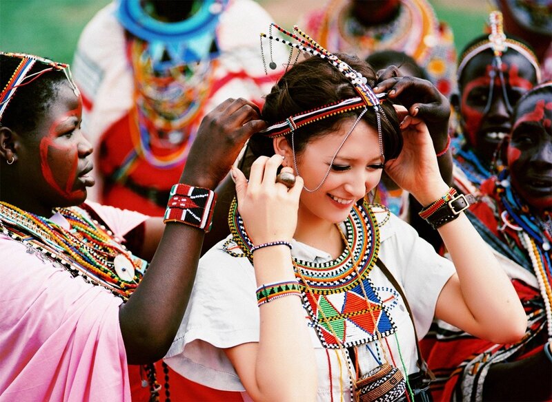 woman receiving traditional adornment