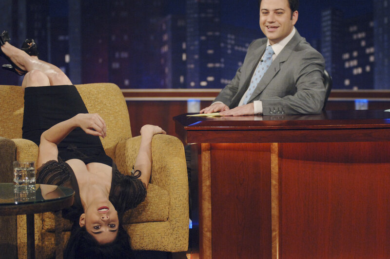 Woman reclining on talk show set