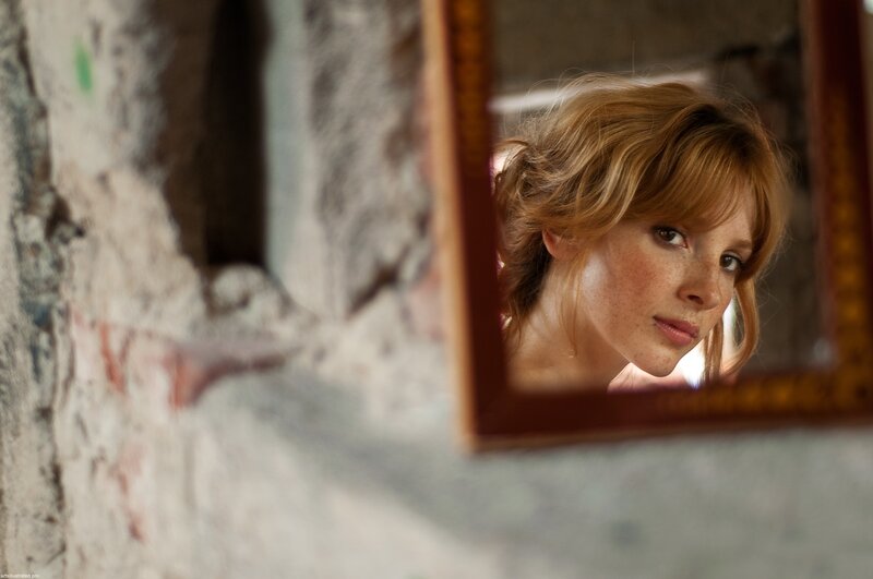 woman reflected in a mirror