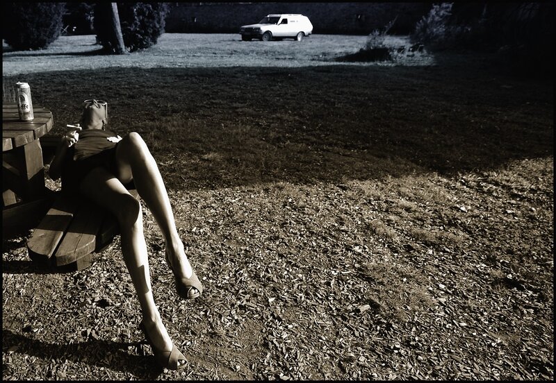 Woman relaxing at a picnic table