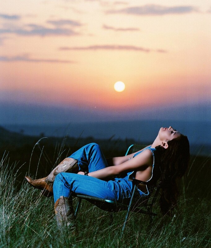 Woman relaxing at sunset
