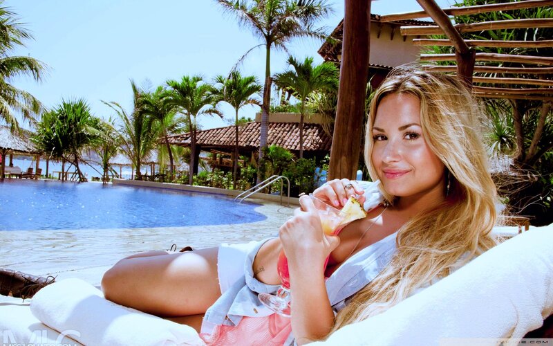 Woman relaxing by pool