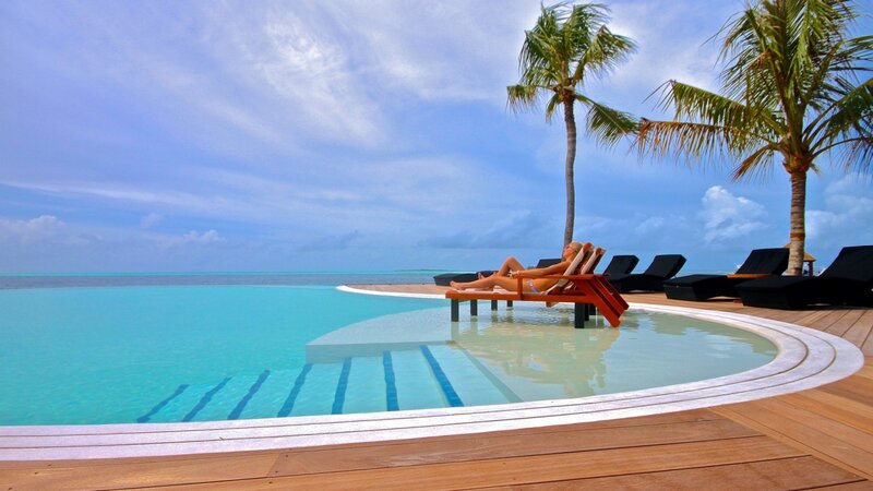 Woman relaxing by pool