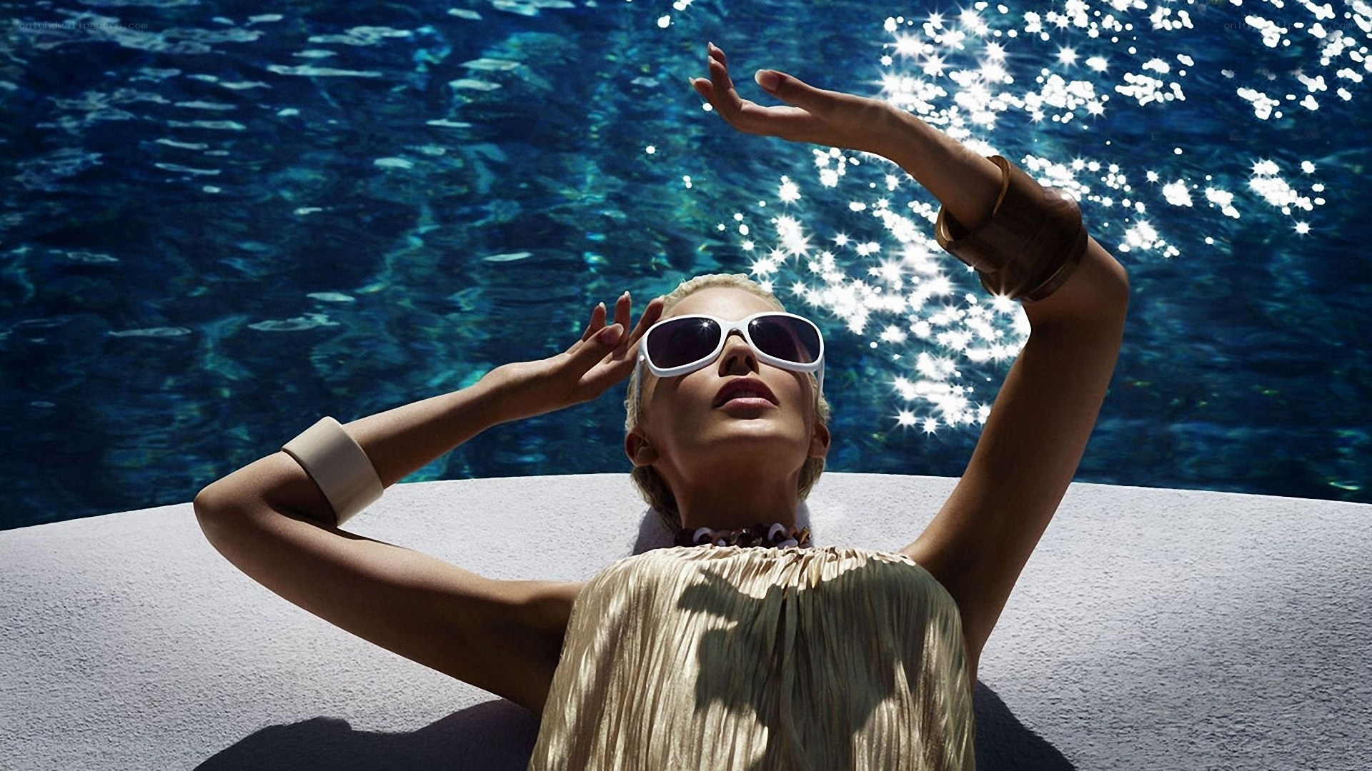 Woman relaxing by pool