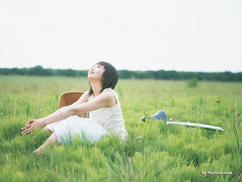 Woman relaxing in a field