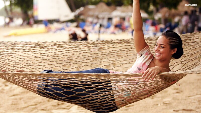 Woman relaxing in a hammock