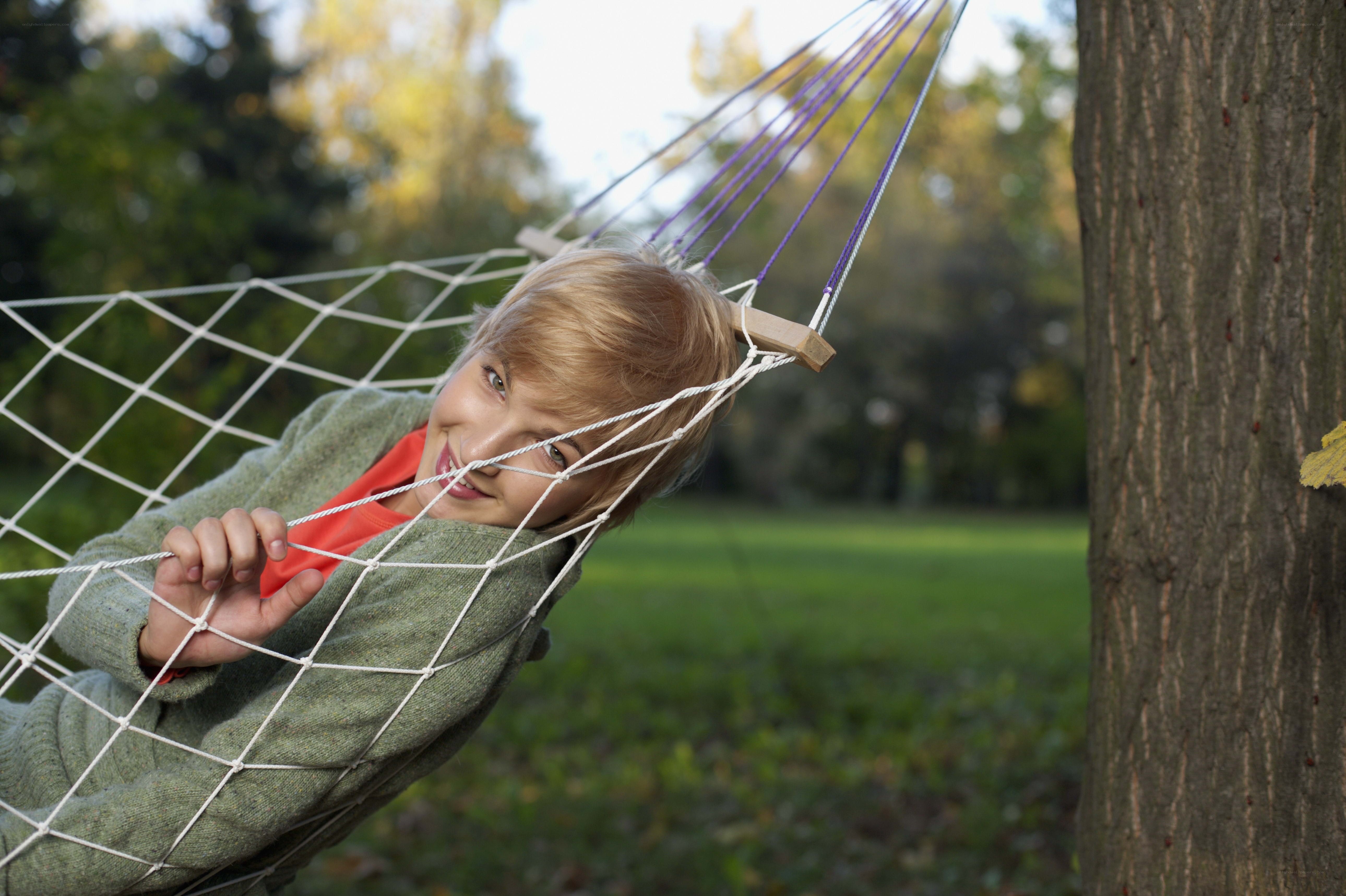 Woman relaxing in a hammock