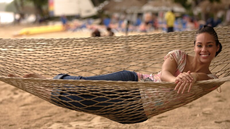 Woman relaxing in a hammock